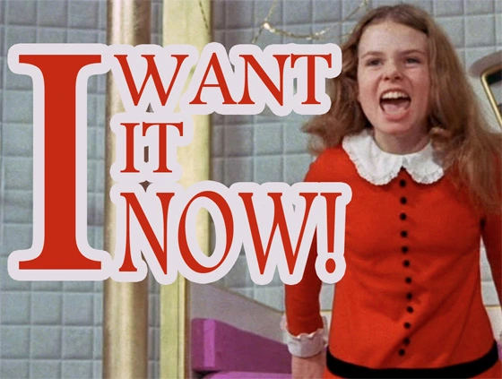 Julie Dawn Cole as Veruca Salt in her red dress, with the words I Want It Now.