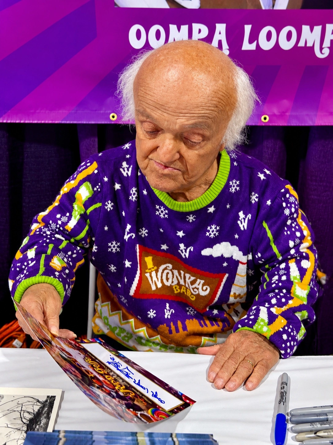 Rusty Goffe looking over my signed custom collage.