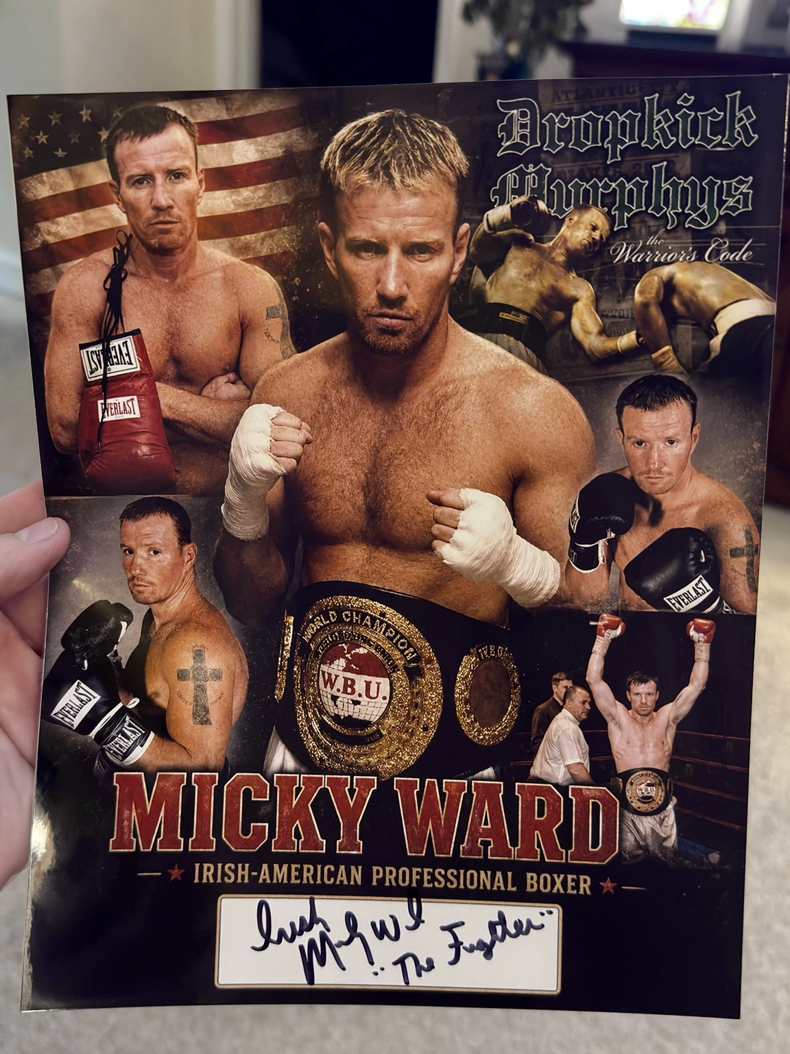 Scott Brooks holding his custom Micky Ward boxing collage, signed by Ward with the inscriptions Irish and The Fighter.
