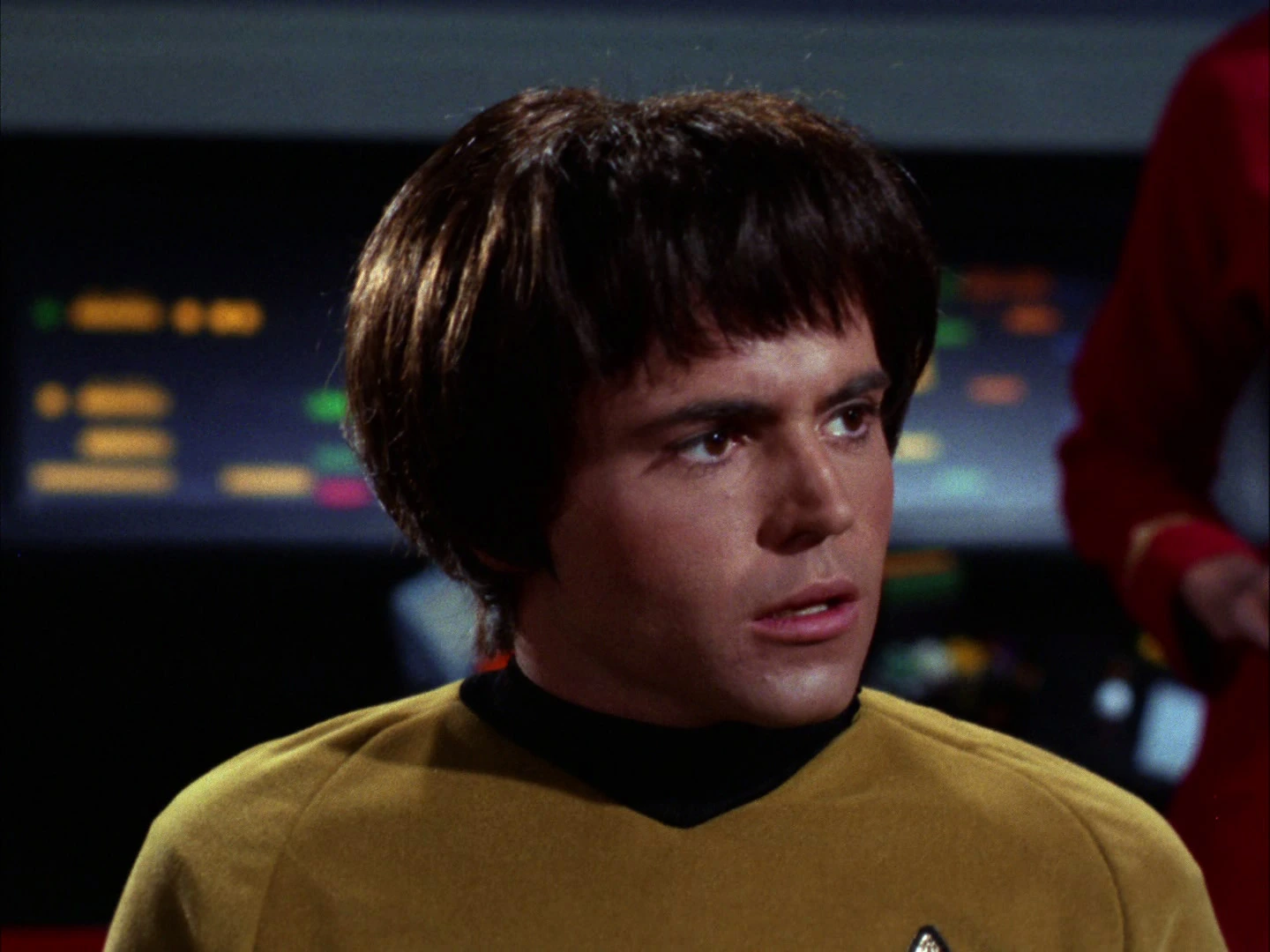 Walter Koenig as Ensign Pavel Chekov in his gold Starfleet uniform on the Enterprise bridge in Catspaw.